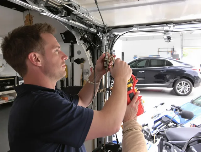 Bedford Heights Garage Door Repair safety certified technician performing cable replacement in Bedford Heights