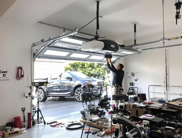 Bedford Heights Garage Door Repair specialist installing smart garage door opener system in Bedford Heights home