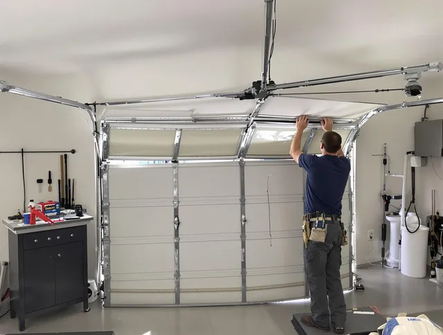 Bedford Heights Garage Door Repair specialist performing precise section replacement on Bedford Heights garage door